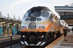 Outbound commuter shoves out of the station